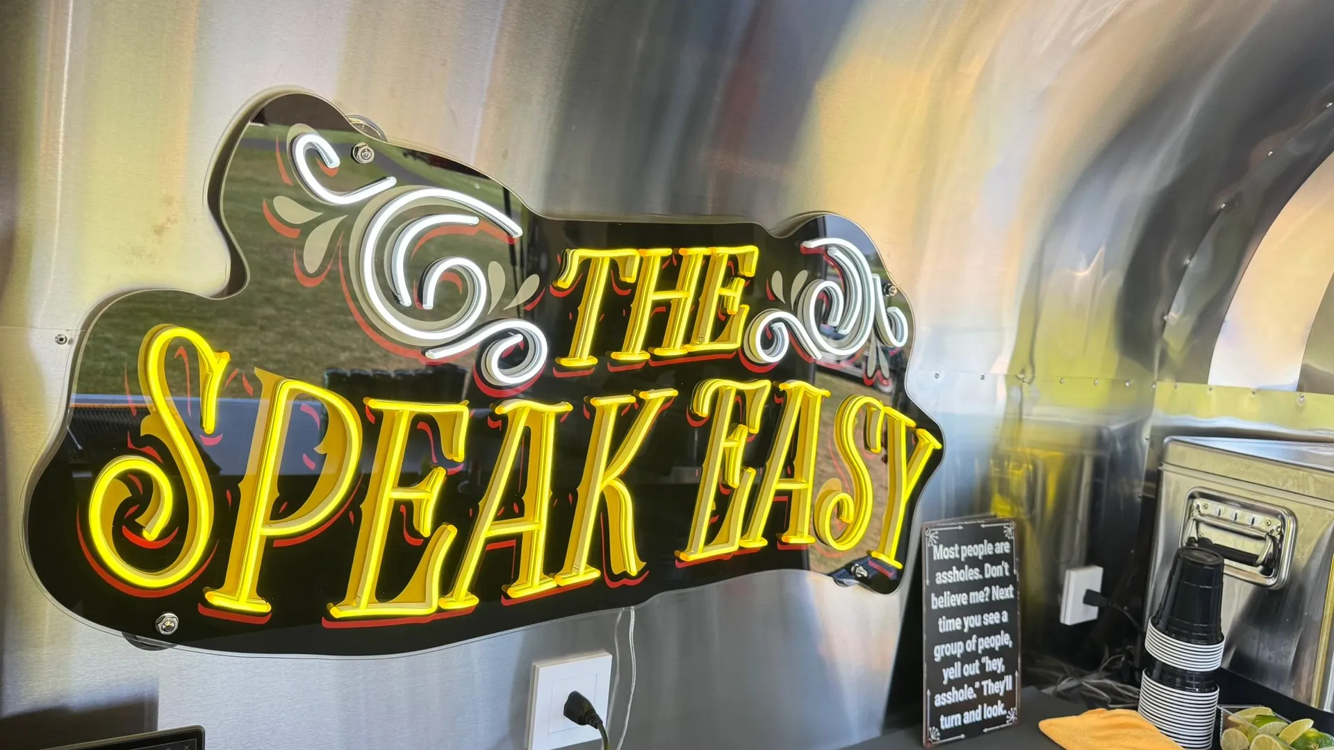 Bartender serving from The Speak Easy mobile bar