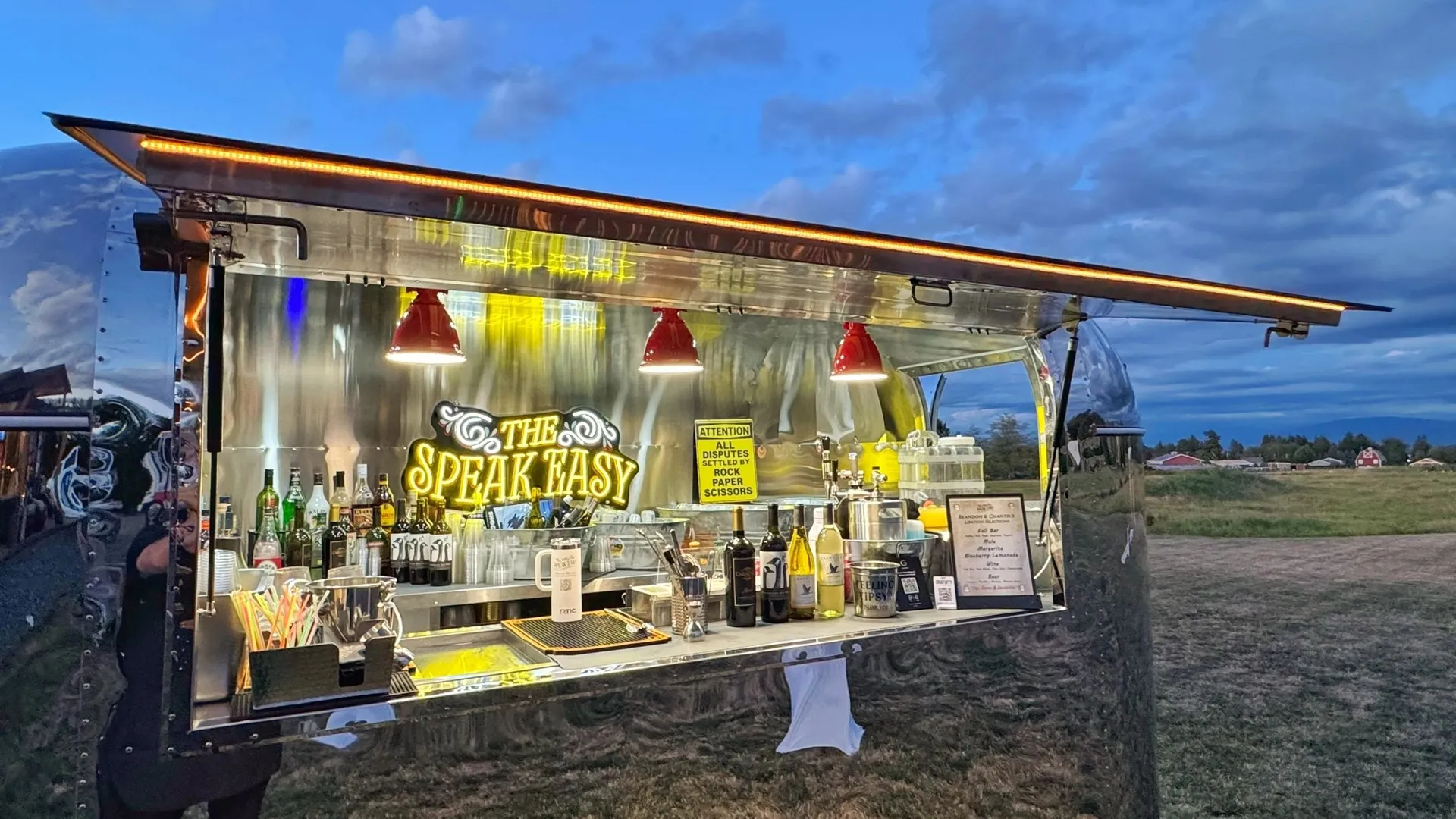 The Speak Easy event setup under a white tent